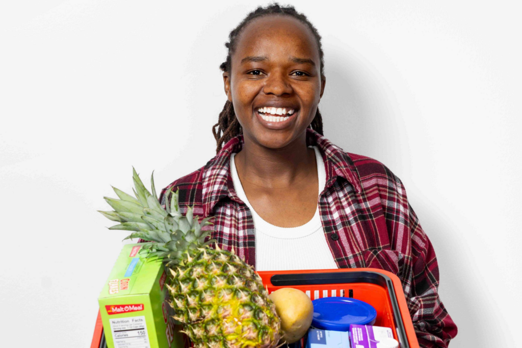 Woman holding shopping basket of food